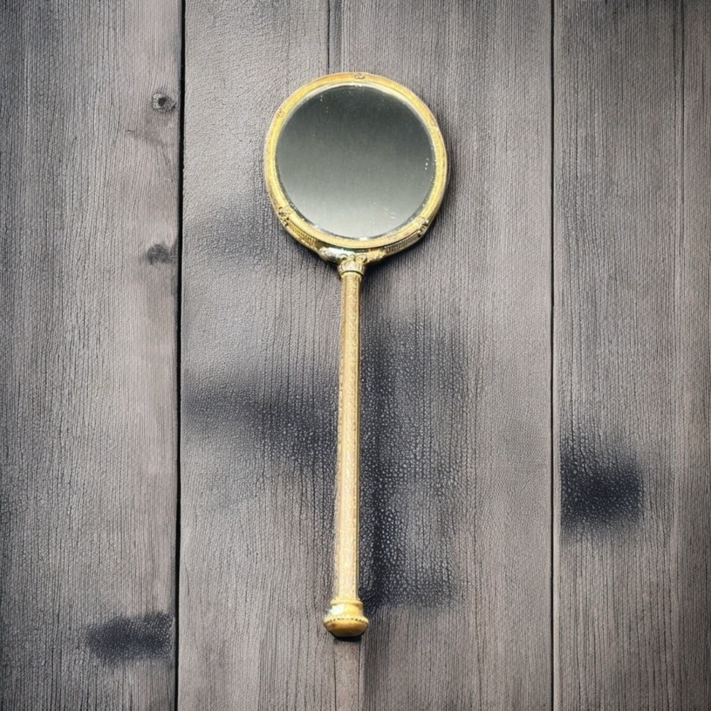 VINTAGE ORNATE HAND MIRROR WITH GREEN ENAMEL BACK AND FLORAL DETAIL